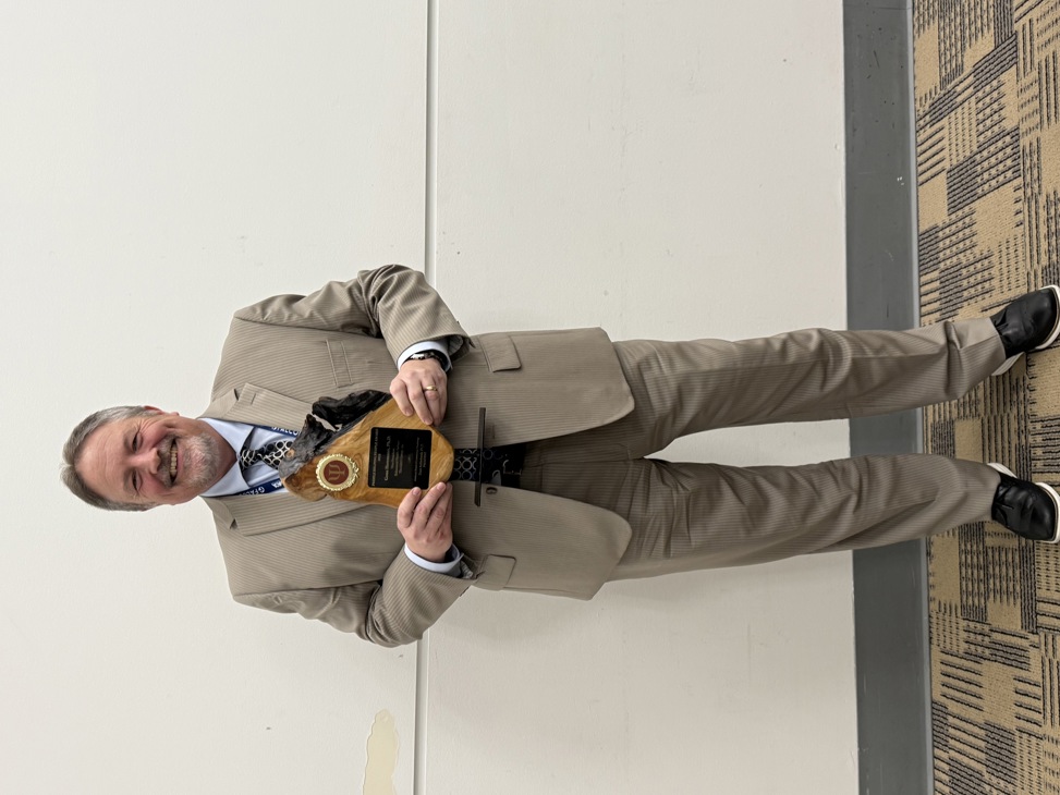 Dr. Eugene Herrmann Presented with an Award at the American Correctional Association Conference